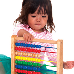 little girl playing with counting toy