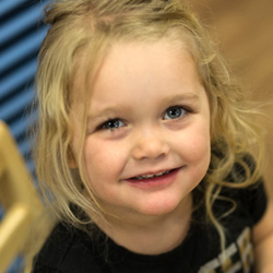 little girl smiling in class