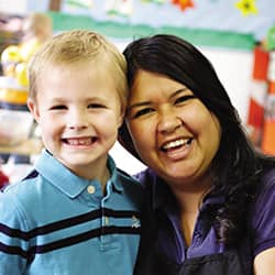 teacher and kids smiling