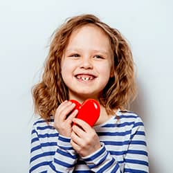 girl holding heart