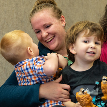 teacher hugging kids